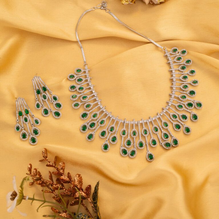 Tiny Green Stones on White Gold AD base gives an charming look