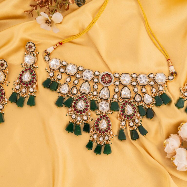 Green Stones on Hefty Kundan set with a Royal Designer Gold base