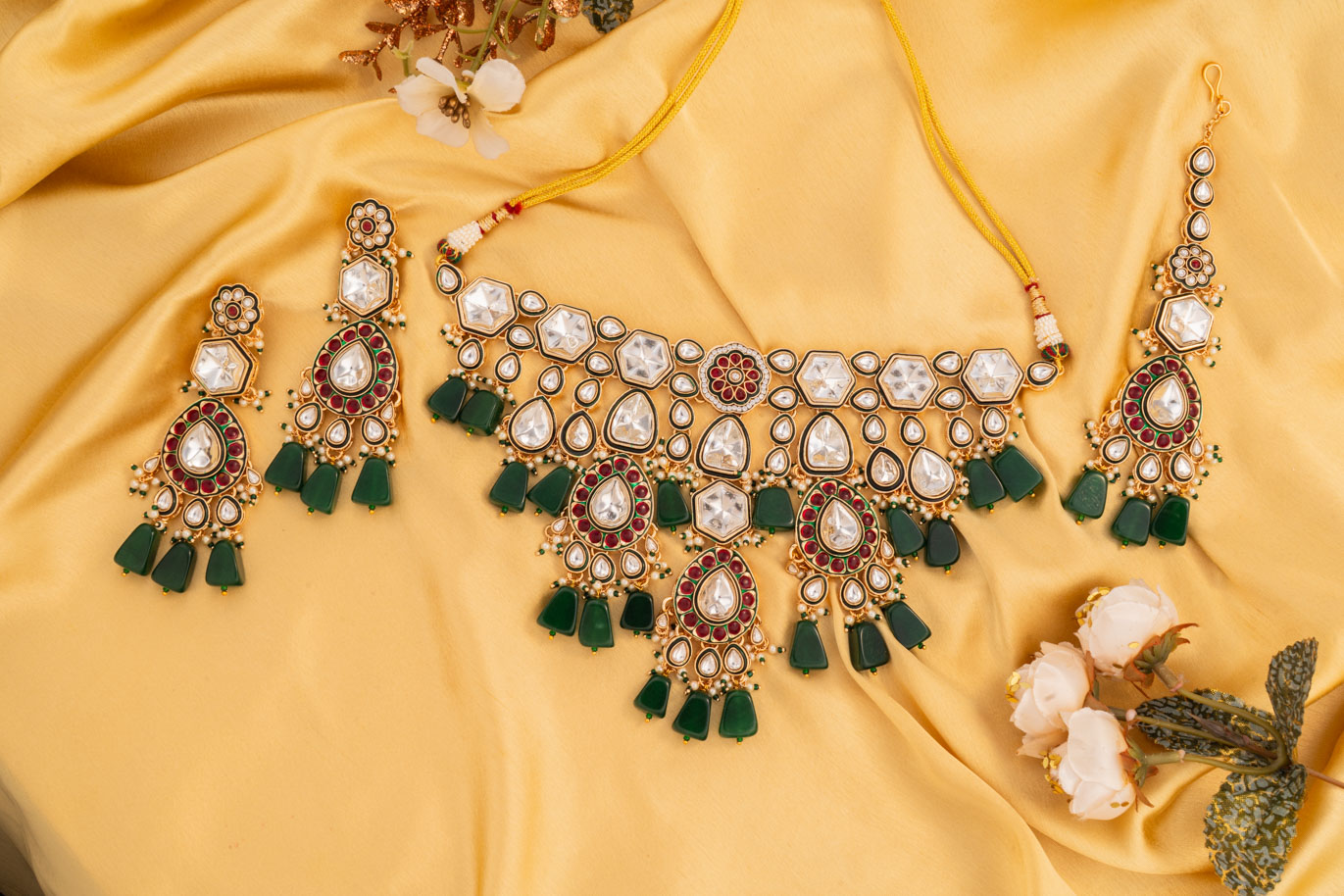 Green Stones on Hefty Kundan set with a Royal Designer Gold base