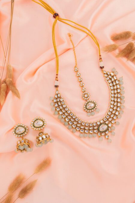 Sky Blue Beads with Kundan paired with Jhumki on Gold Base